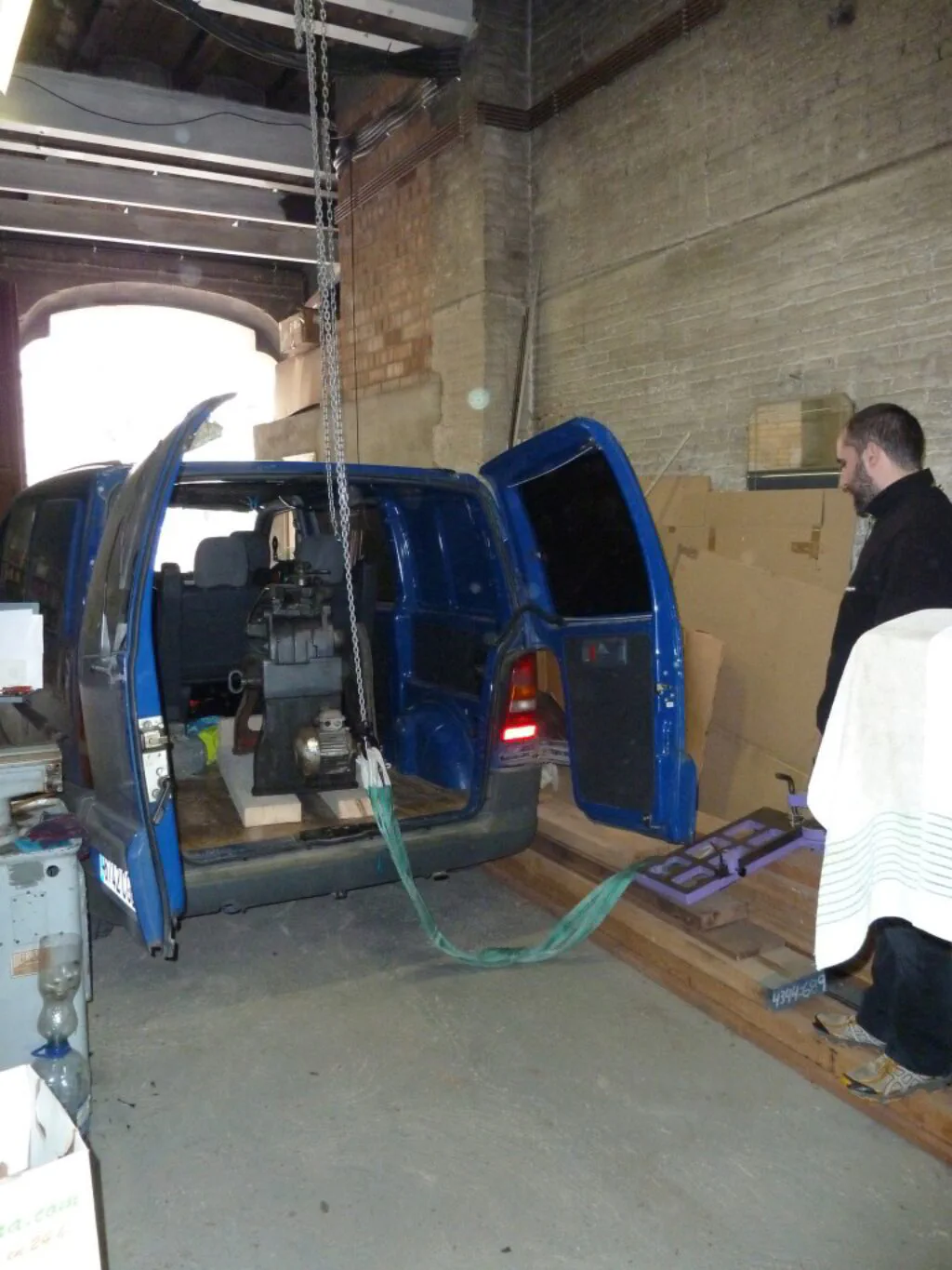 Unloading the Uniz saw from the van