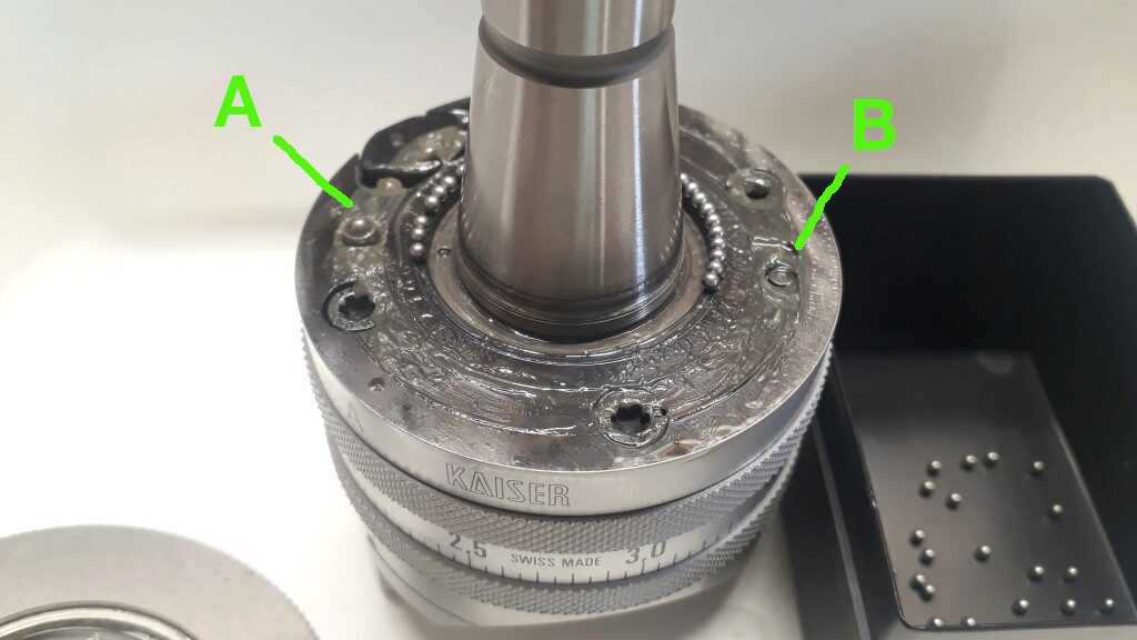 Marked as (A) there is the clutch shaft. Marked as (B)
is the top ring plunger spring.