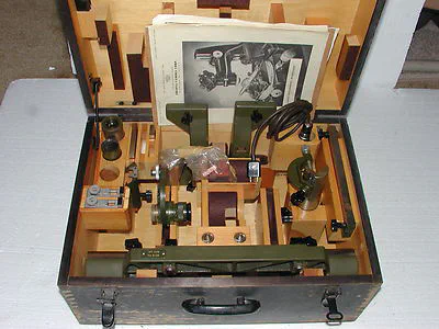 A wooden box with Zeiss toolmaker's microscope accessories